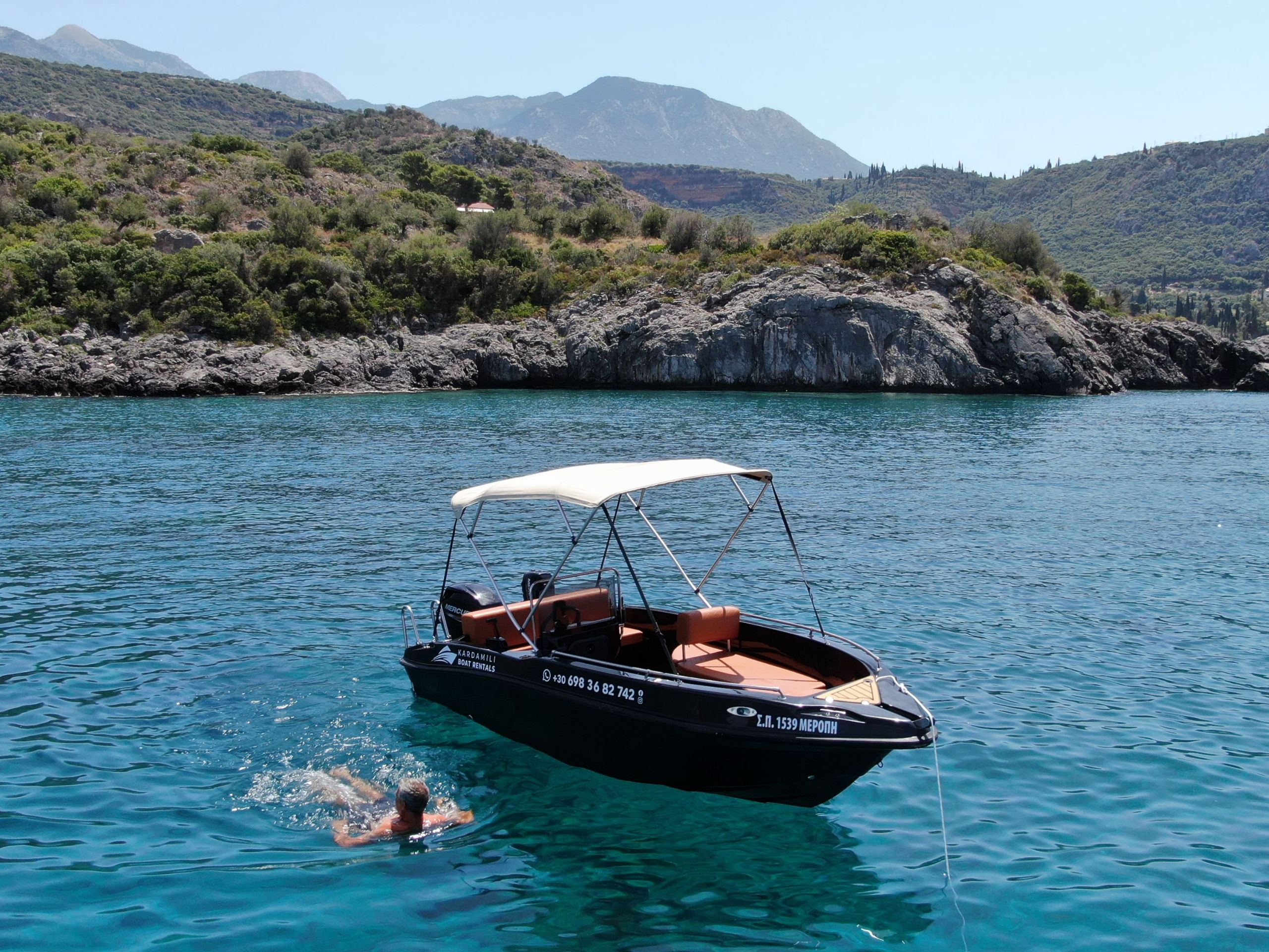 This is an image of our black Kardamili Boat Rentals boat called Meropi, as seen from above.