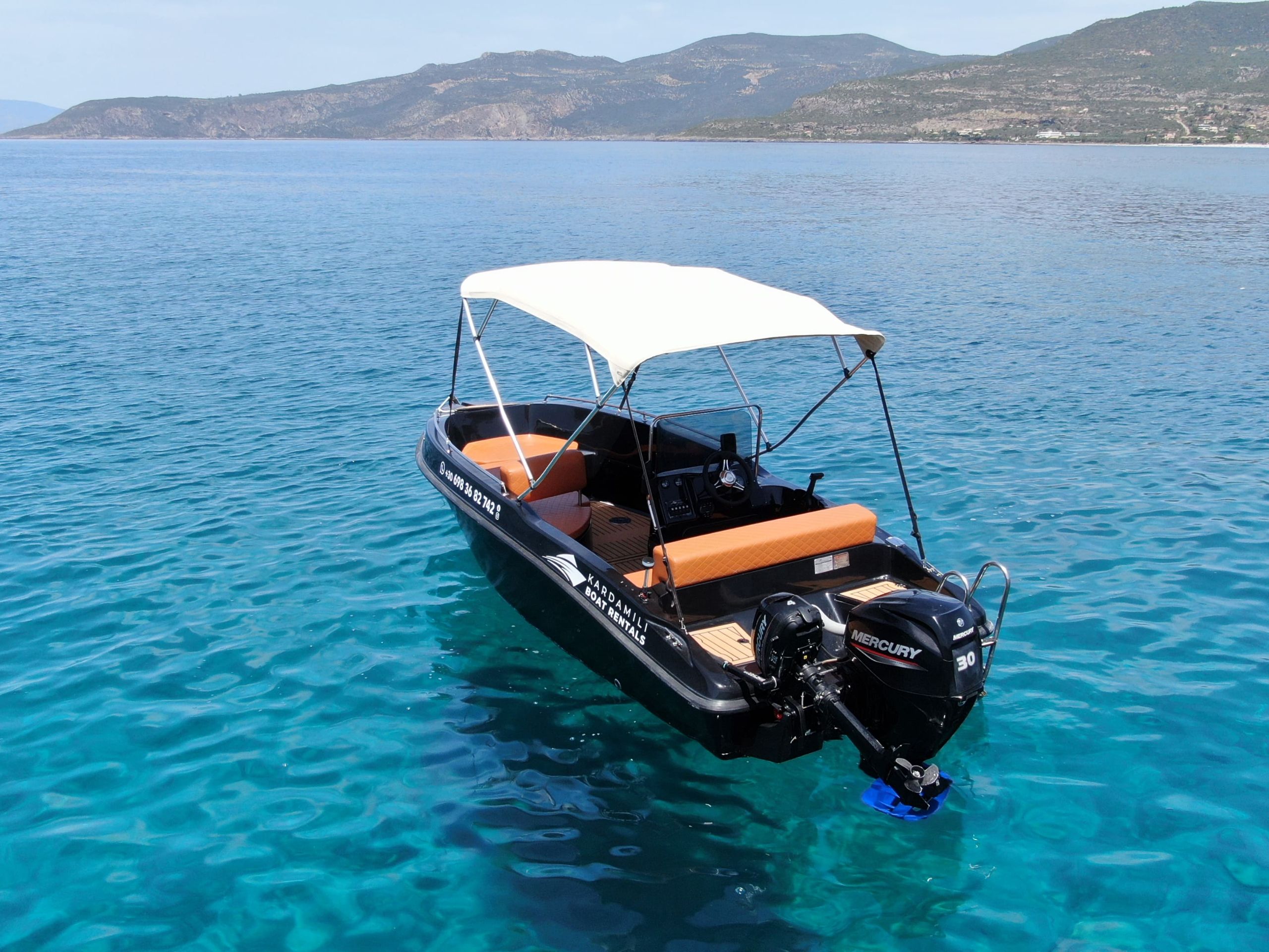 This is an image of our black Kardamili Boat Rentals boat called Meropi, as seen from above.