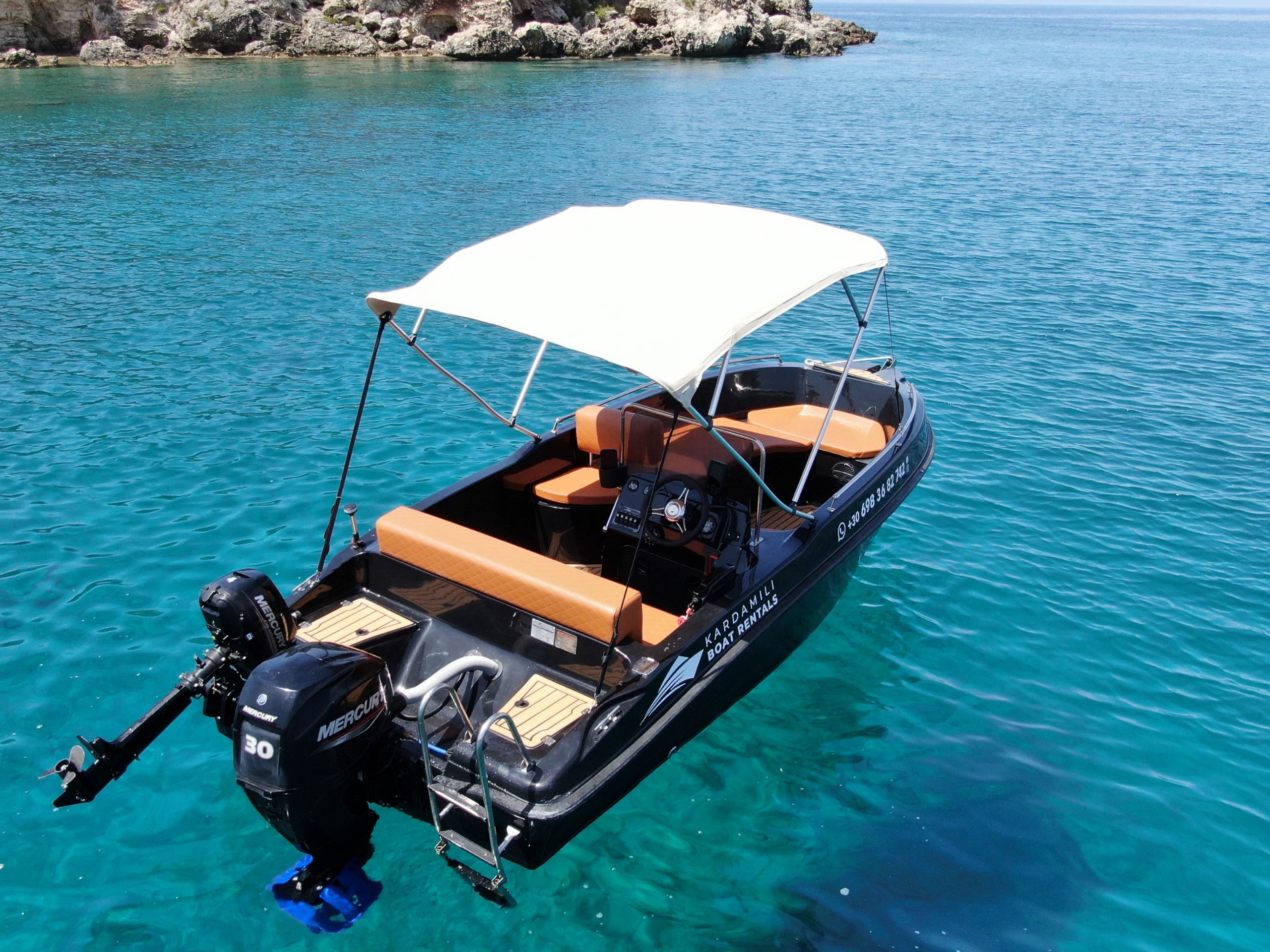 This is an image of our black Kardamili Boat Rentals boat called Meropi, as seen from above.